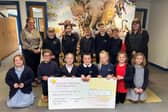 Clarborough Primary School children pictured with cheque and Fundraising Manager for DBTH Charity