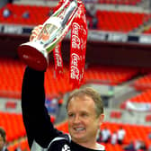 Sean O'Driscoll celebrates with the play-off trophy