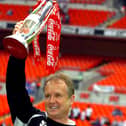 Sean O'Driscoll celebrates with the play-off trophy