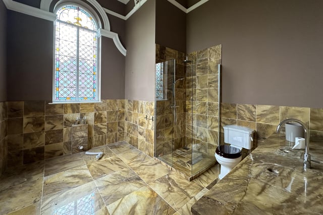One of the luxurious marble en suite bathrooms to six bedrooms.