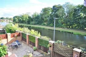 A home in an idyllic location next to a scenic stretch of canal.