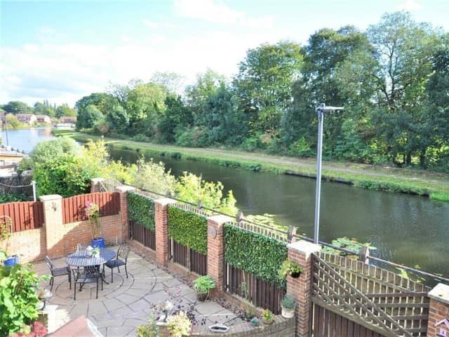 A home in an idyllic location next to a scenic stretch of canal.
