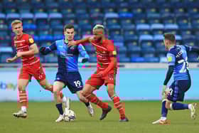 John Bostock holds off Wycombe Wanderers' Anis Mehmeti. Picture: Gareth Williams/AHPIX LTD