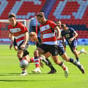 Doncaster Rovers' Tyler Roberts goes on the attack against Port Vale.
