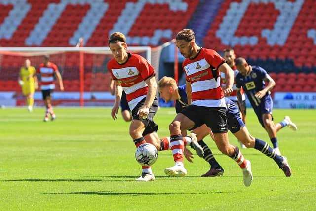 Doncaster Rovers' Tyler Roberts goes on the attack against Port Vale.