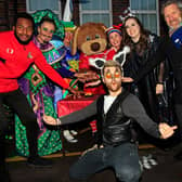 Doncaster Rovers defender Cameron John, Donny Dog, Aladdin cast members Abanazar, Widow Twanky, Wishee, Scheherazade, Lemmi the Lemur and Alexis Johnson, Principle, pictured switching on the Christmas Lights.