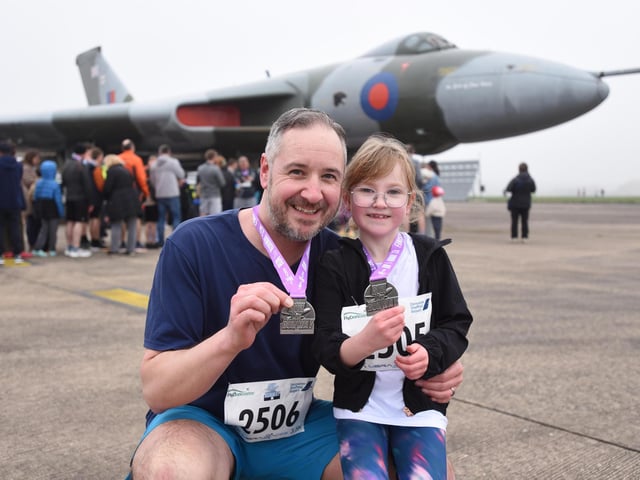 Steve Newton and daughter Daisy, 7, from Sheffield with their medals after completing the 3.5k race.