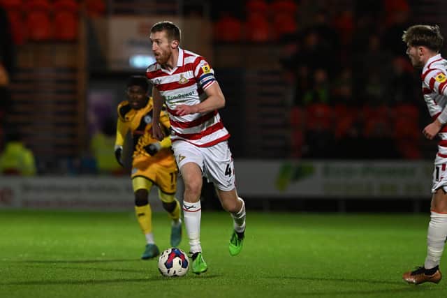 Tom Anderson turned down interest elsewhere to sign a new contract with Doncaster Rovers.