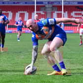 Sam Smeaton scores on his 100th appearance for the Dons. Picture: Howard Roe/AHPIX.com