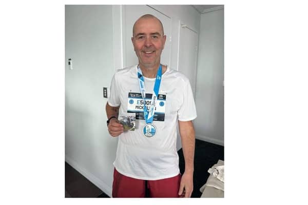Michael Allen pictured with his medal.