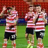 Doncaster Rovers' players react to their penalty shoot-out loss to Man United's under-21s.