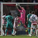 Jonathan Mitchell catches the ball under pressure against Tranmere.