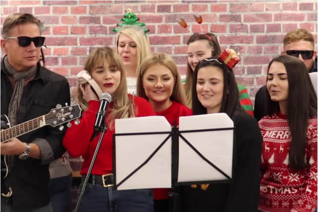 Staff at Multi Web Marketing perform the Band Aid classic Do They Know Its Christmas?
