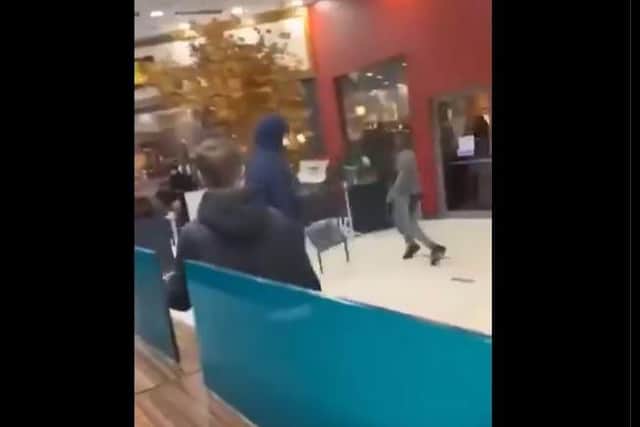 Yobs were filmed hurling chairs at each other in Doncaster's Frenchgate centre. (Photo: Football Fights/X).