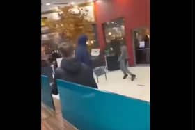 Yobs were filmed hurling chairs at each other in Doncaster's Frenchgate centre. (Photo: Football Fights/X).