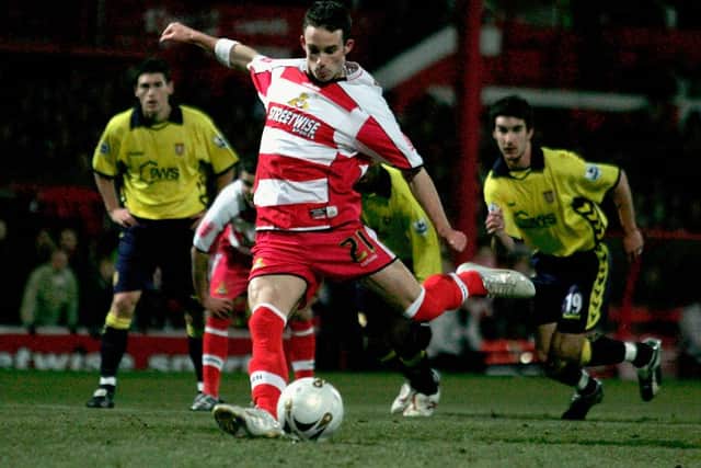 Michael McIndoe of Doncaster Rovers scores from the penalty spot. (Photo by Shaun Botterill/Getty Images)