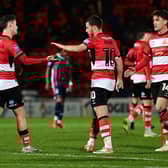 Luke Molyneux celebrates his goal with Tommy Rowe and Harrison Biggins. Picture: Andrew Roe/AHPIX LTD