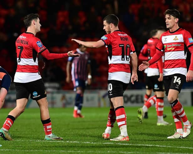 Luke Molyneux celebrates his goal with Tommy Rowe and Harrison Biggins. Picture: Andrew Roe/AHPIX LTD