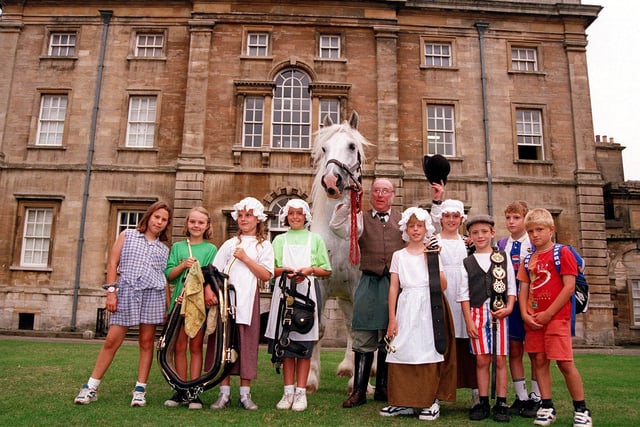Horsekeeper David Bell is pictured with William the shire horse and, from left,  Stephanie Hine, aged ten, Sophie Hale, aged eight, Harmione Brough, aged nine, Lucy Gill, Rebecca Lane, both aged ten, Daniel Hitchen, aged eight, Claire Marshall, aged ten, Daniel Cheetham and Thomas Carpenter, both aged eight, outside Cusworth Hall, August 20, 1996