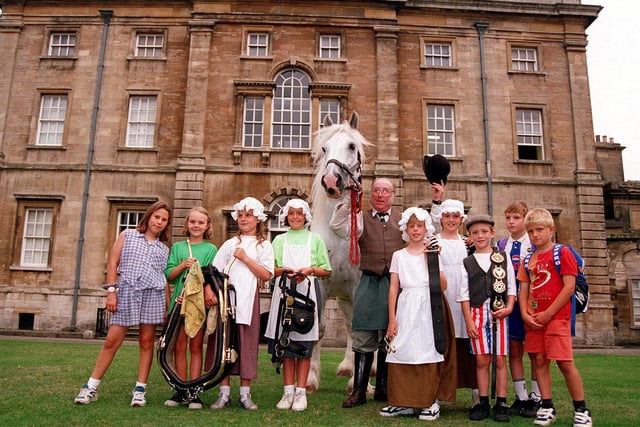 Horsekeeper David Bell is pictured with William the shire horse and, from left, Stephanie Hine, aged ten, Sophie Hale, aged eight, Harmione Brough, aged nine, Lucy Gill, Rebecca Lane, both aged ten, Daniel Hitchen, aged eight, Claire Marshall, aged ten, Daniel Cheetham and Thomas Carpenter, both aged eight, outside Cusworth Hall, August 20, 1996