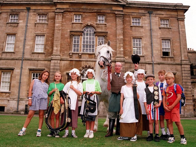 Horsekeeper David Bell is pictured with William the shire horse and, from left, Stephanie Hine, aged ten, Sophie Hale, aged eight, Harmione Brough, aged nine, Lucy Gill, Rebecca Lane, both aged ten, Daniel Hitchen, aged eight, Claire Marshall, aged ten, Daniel Cheetham and Thomas Carpenter, both aged eight, outside Cusworth Hall, August 20, 1996