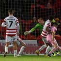 Jonathan Mitchell can't keep out Gold Omotayo's header. Picture: Howard Roe/AHPIX.com