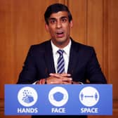 Britain's Chancellor of the Exchequer Rishi Sunak speaks during a virtual press conference on the coronavirus pandemic inside 10 Downing Street (Photo by HENRY NICHOLLS/POOL/AFP via Getty Images)