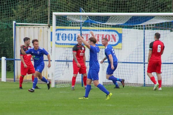 Jack Watson, left, celebrates scoring the decisive goal for Rossington. Photo: Steve Pennock