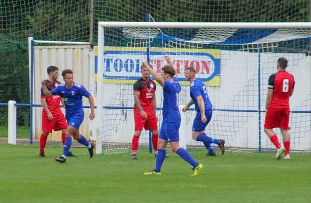 Jack Watson, left, celebrates scoring the decisive goal for Rossington. Photo: Steve Pennock