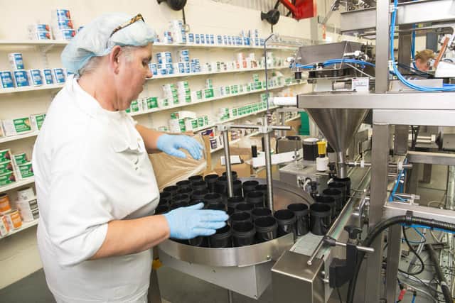 World Feeds ThorneBusiness FeaturePam Marsden sorting the containers