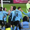Rovers celebrate the fourth goal in the win at Fleetwood last night.