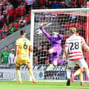 George Miller scores a late winner for Doncaster Rovers against Sutton with his first goal for the club.