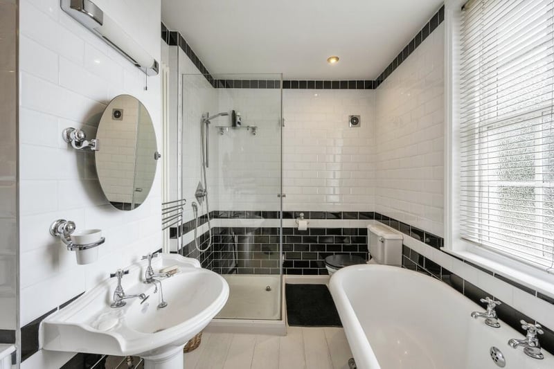 A contemporary style bathroom with both bath and separate shower.