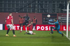 Fejiri Okenabirhie fires a shot on goal against FC United of Manchester. Picture: Greg Dunbavand/AHPIX