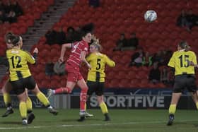 Belles captain Jess Andrew heads home their second goal against Burton Albion. Pictures by Howard Roe/AHPIX LTD