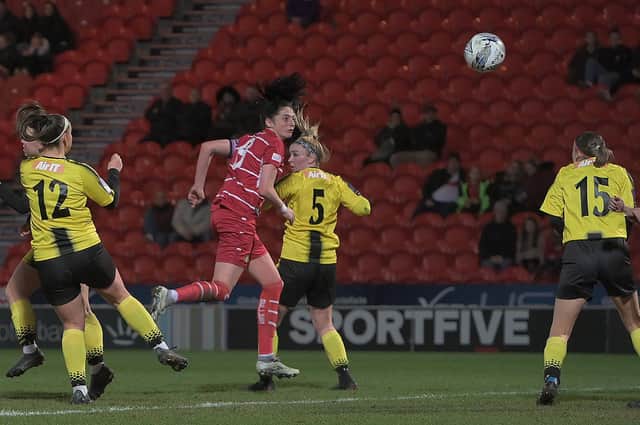 Belles captain Jess Andrew heads home their second goal against Burton Albion. Pictures by Howard Roe/AHPIX LTD