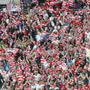 Doncaster Rovers fans celebrate victory over Leeds United in the League One play-off final at Wembley
