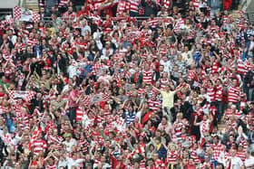 Doncaster Rovers fans celebrate victory over Leeds United in the League One play-off final at Wembley