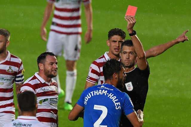 Stockport County's Macauley Southam-Hales sees red against Doncaster Rovers.