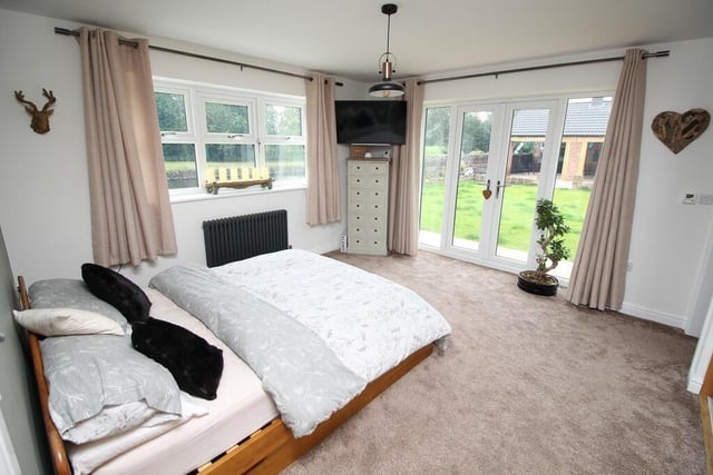 This bedroom has canal views and access to the gardens.