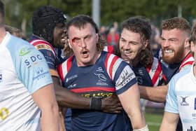 ohn Kelly celebrates his second try against Bedford Blues.