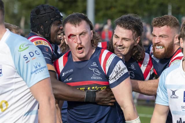 ohn Kelly celebrates his second try against Bedford Blues.