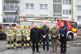 Cllr Glyn Jones (Deputy Mayor and Cabinet Member for Housing and Business); Chris Margrave (Director of Property Services at St Leger Homes); Dave Wilkinson (Chair of the St Leger Homes Board); and Cath Toovey (South Yorkshire Fire and Rescue Area Manager); with firefighters from South Yorkshire Fire and Rescue.