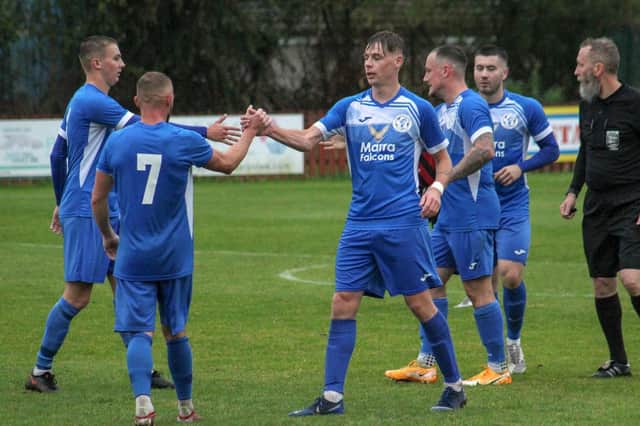 Adam Baskerville, centre, scored a hat trick for Armthorpe Welfare in their 6-0 win at Dronfield Town. Photo: Steve Pennock