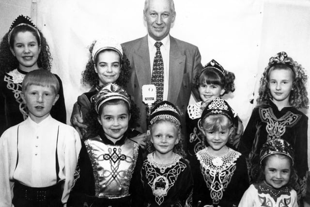 Pictured at a charity night organised by the Doncaster Irish Society at the Sprotbrough Parish club to raise money for a Pulse Oxymeter for the children's ward at Doncaster Royal Infirmary, is Irish Society chairman, Mat McBride, with some of the Margaret McAleer dancers, May 1997