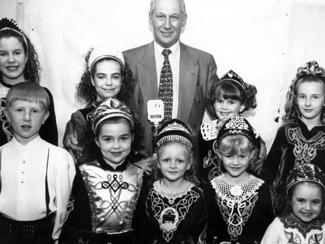 Pictured at a charity night organised by the Doncaster Irish Society at the Sprotbrough Parish club to raise money for a Pulse Oxymeter for the children's ward at Doncaster Royal Infirmary, is Irish Society chairman, Mat McBride, with some of the Margaret McAleer dancers, May 1997