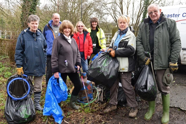 Liz Reeve, Don Gorge Community Group secretary and Sean Price, DMBC Stronger Community Officer (middle), pictured with volunteers as they take part in the Big Spring Clean at Sprotbrough Falls in 2017
