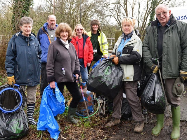 Liz Reeve, Don Gorge Community Group secretary and Sean Price, DMBC Stronger Community Officer (middle), pictured with volunteers as they take part in the Big Spring Clean at Sprotbrough Falls in 2017
