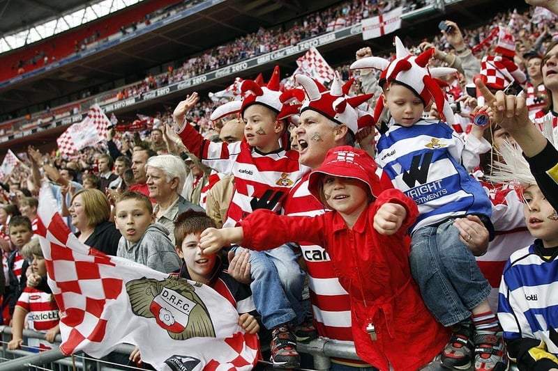 Doncaster Rovers supporters celebrate after beating Leeds United.