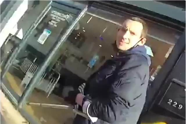 Richard Newton lashes out at a police officer with a crutch in Sheffield.